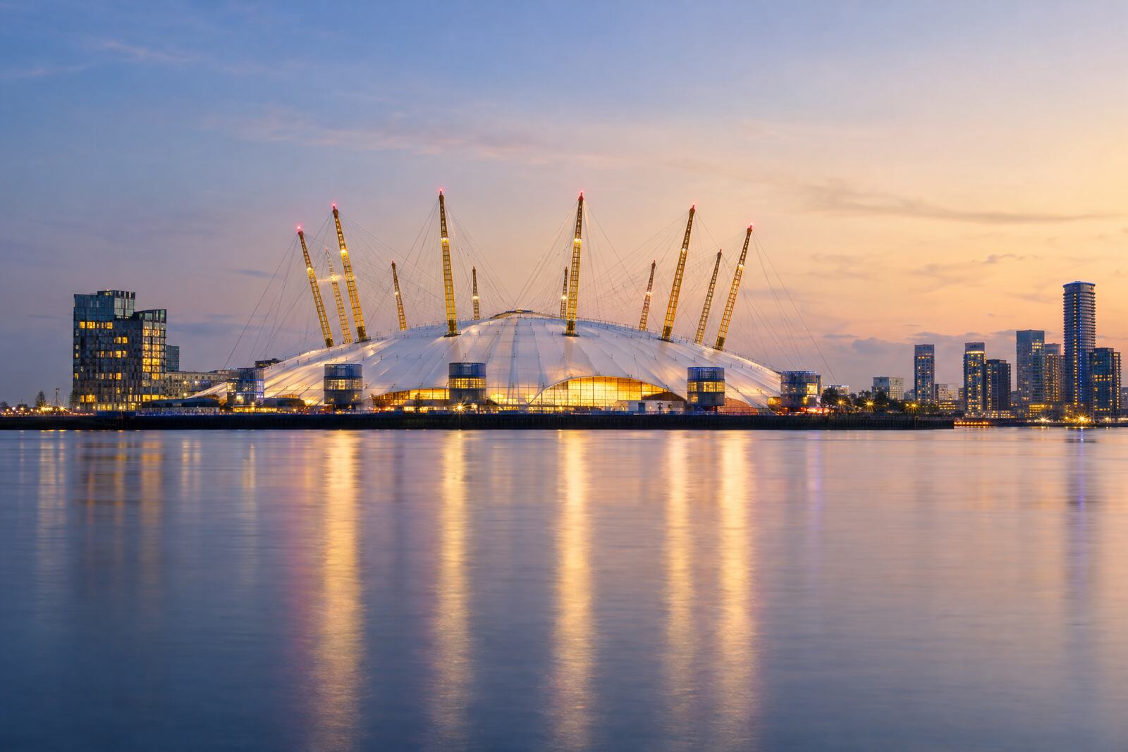 The O2 on Greenwich Peninsula at dusk, reflected in the River Thames